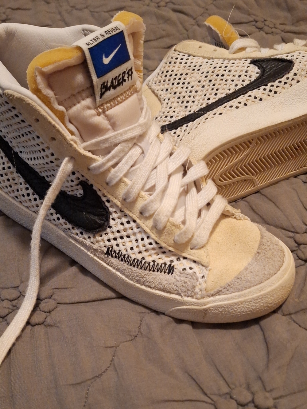Nike White Mesh Mid-Top Sneakers with Black Swoosh and Yellow Tongue Accents